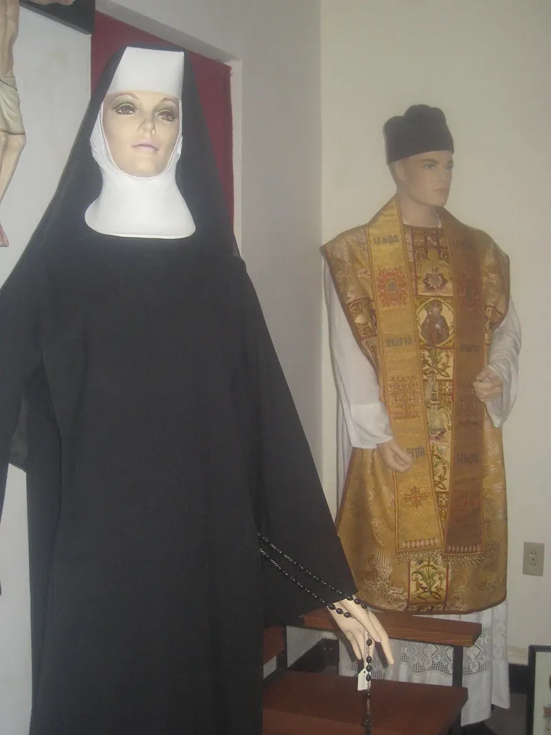 Mannequins in a sister's habit and priest's vestments
